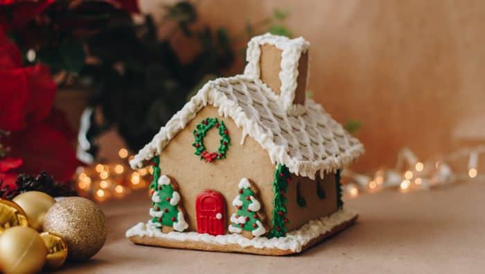 a gingerbread house decorated with christmas decorations