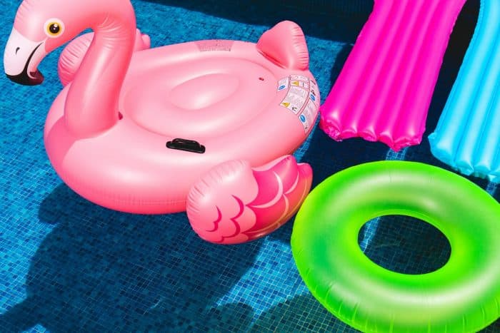 Pool Party 1 pink inflatable flamingo and green inflatable ring