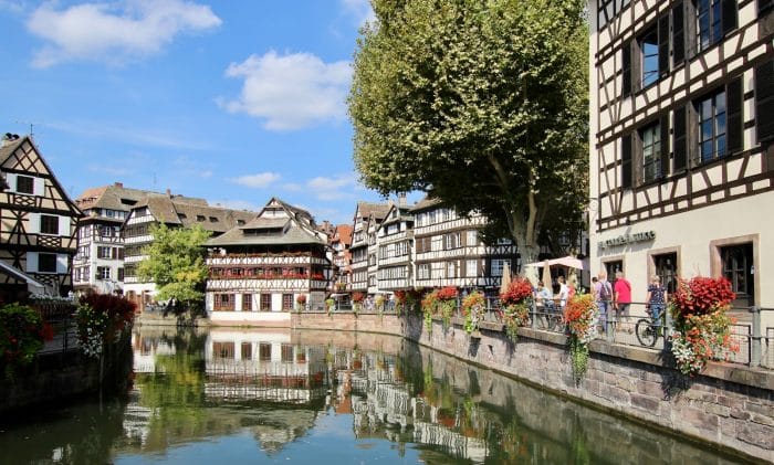 Visite insolite de Strasbourg 1 building near body of water during daytime